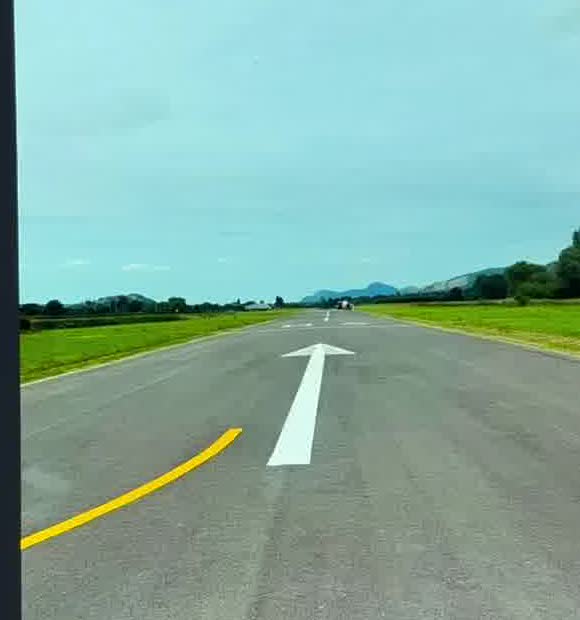 Faded runway markings before refurbishment at Welshpool Airport