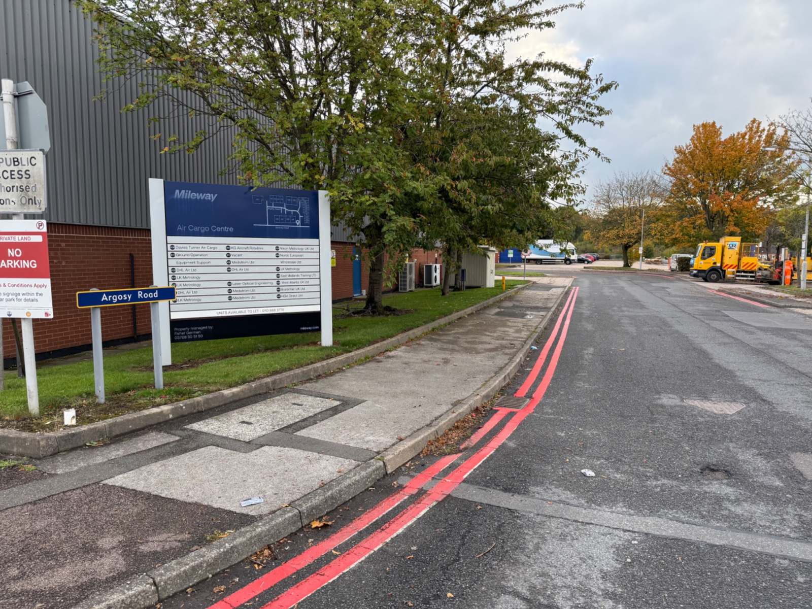 Double red lines beside the Argosy Road sign at East Midlands Airport